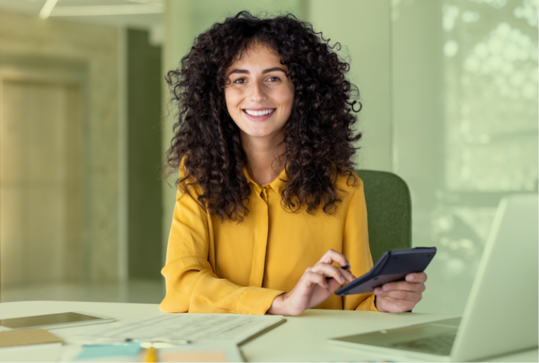 An employee is easily calculating overtime pay and looks happy