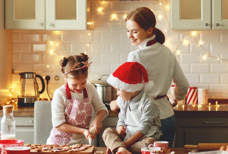family basking wearing festive Christmas outifts on