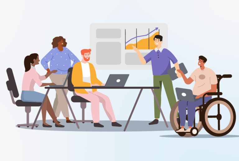 Group of diverse people working together around a table on laptops.