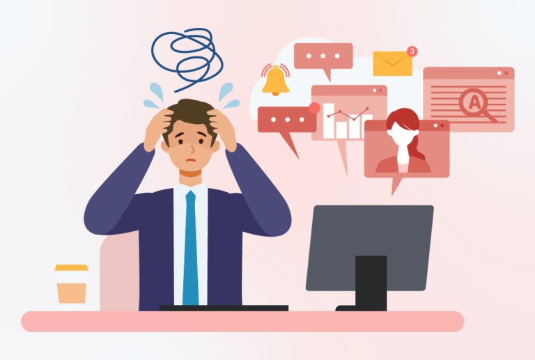 A male employee wearing a suit with hands on his head, stressed with a computer beside him with a lot of notifications.