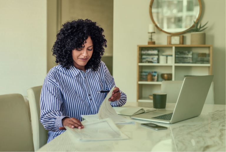 An employer is checking their latest employment contract to ensure remote work compliance.