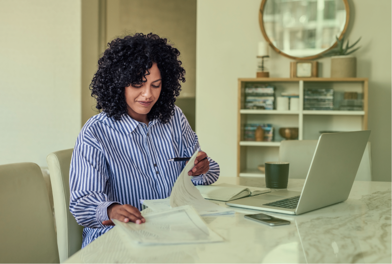 An employer is checking their latest employment contract to ensure remote work compliance.