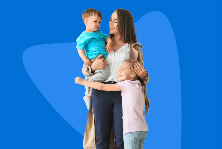 A mother holding her toddler son and grade school daughter.