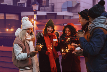 A group of employees are outside, dressed for cool weather, smiling and enjoying a non-statutory holiday shutdown from their employer