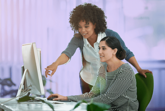 Women working with AI on their workplace