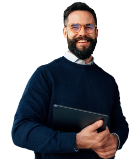 Man smiling, wearing business casual, holding a tablet.