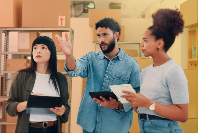 Three employees are following checklists and completing a workplace inspection