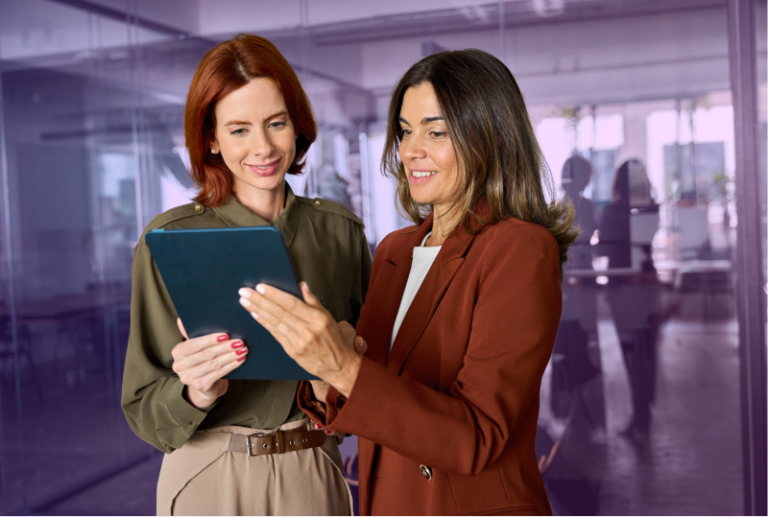 Two employees are booking time off on a tablet.