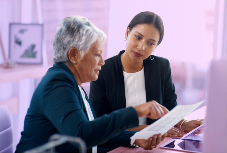 An HR professional and a retiree are working through a retirement process checklist together.