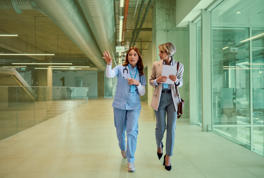 Two public sector employees dressed in scrubs are preparing for the AODA deadline