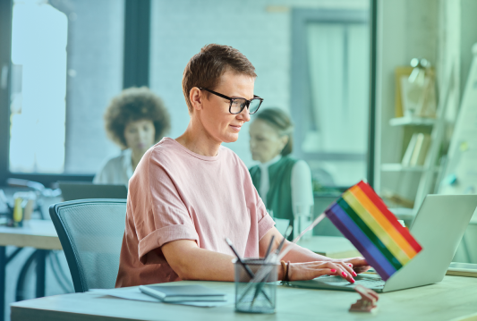 An employee is commemorating Pride Month at their desk.